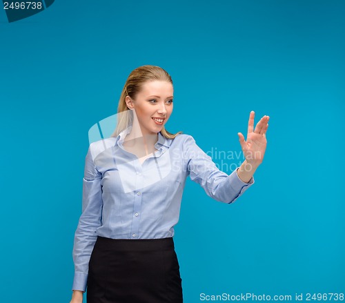 Image of woman working with imaginary virtual screen