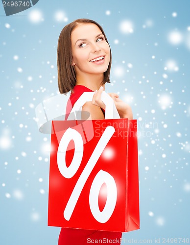 Image of woman in red dress with shopping bags