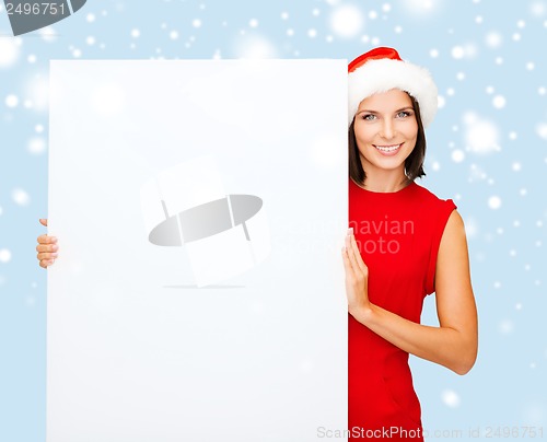 Image of woman in santa helper hat with blank white board