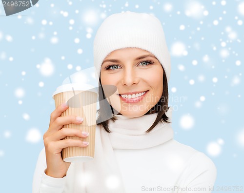 Image of woman in hat with takeaway tea or coffee cup