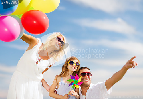 Image of family with colorful balloons