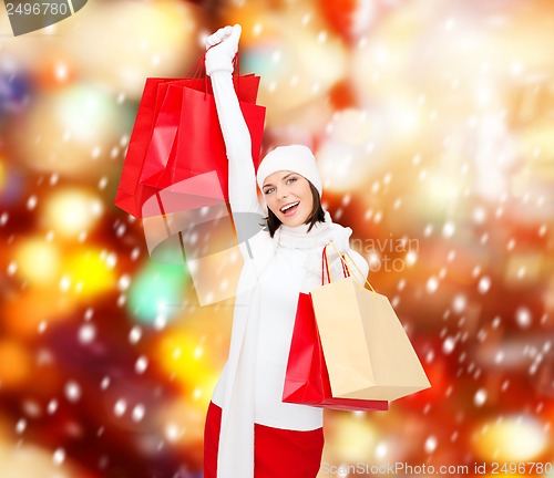 Image of picture of happy woman with shopping bags