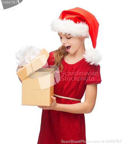 Image of smiling girl in santa helper hat with gift box