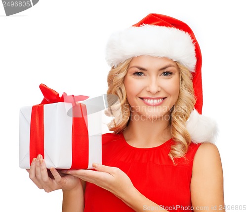 Image of smiling woman in santa helper hat with gift box