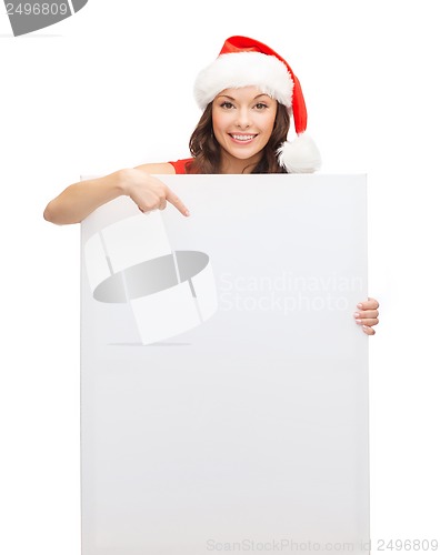 Image of woman in santa helper hat with blank white board