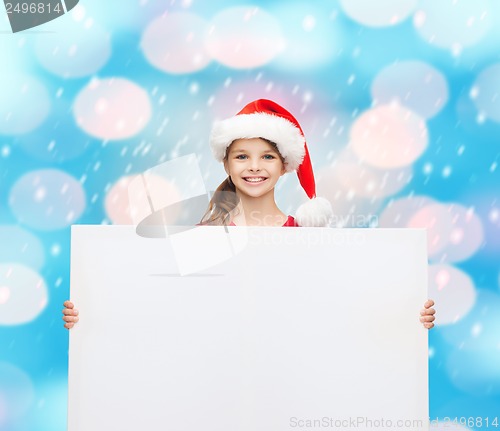 Image of woman in santa helper hat with blank white board