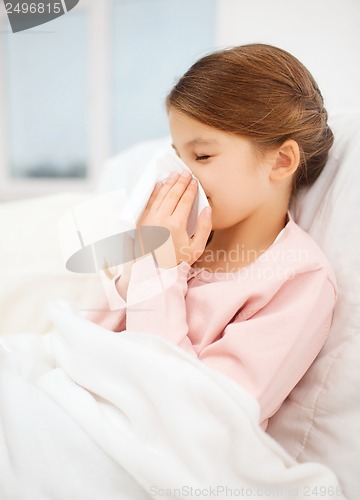 Image of ill girl with paper tissue