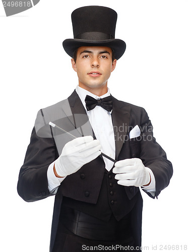 Image of magician in top hat with magic wand showing trick