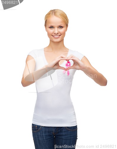 Image of woman in blank t-shirt with pink cancer ribbon