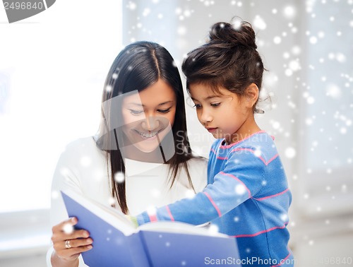 Image of mother and daughter with book