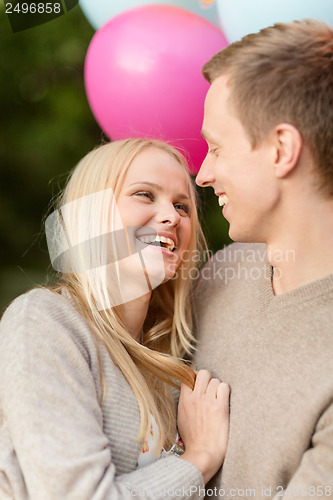 Image of couple with colorful balloons