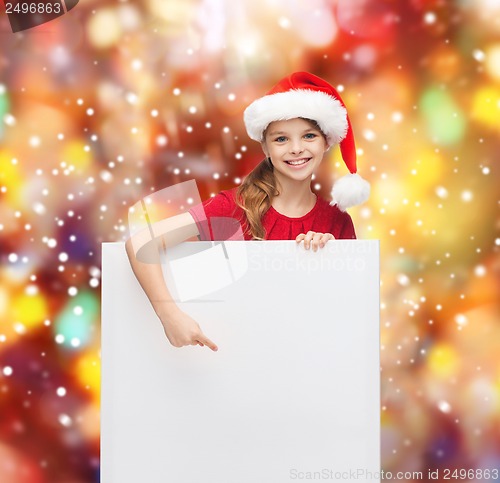 Image of woman in santa helper hat with blank white board