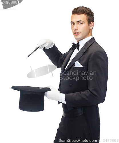 Image of magician in top hat with magic wand showing trick