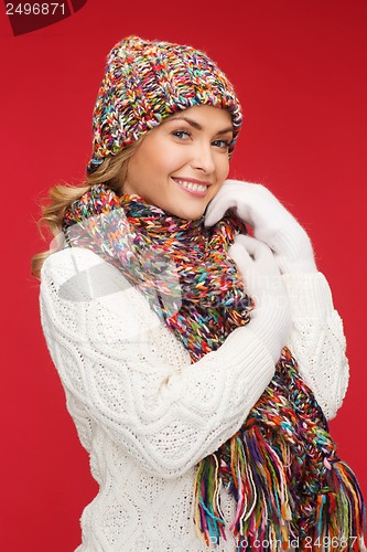 Image of woman in hat, scarf and mittens