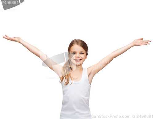 Image of smiling teenage girl with raised hands