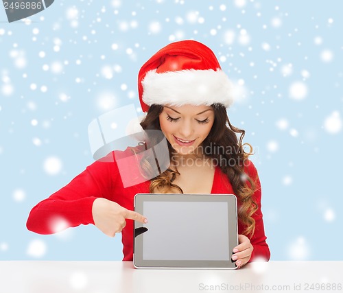 Image of woman in santa helper hat with tablet pc