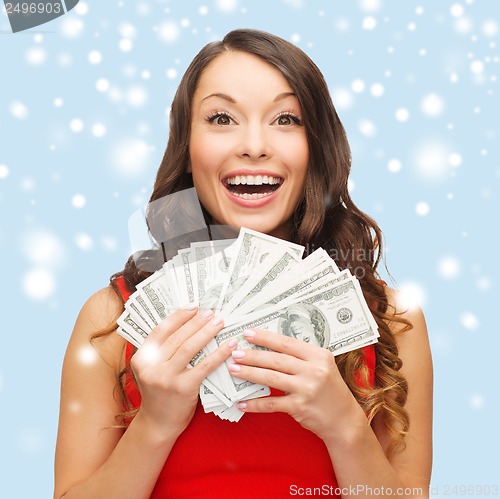 Image of woman in red dress with us dollar money