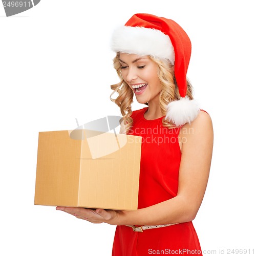 Image of smiling woman in santa helper hat with gift box