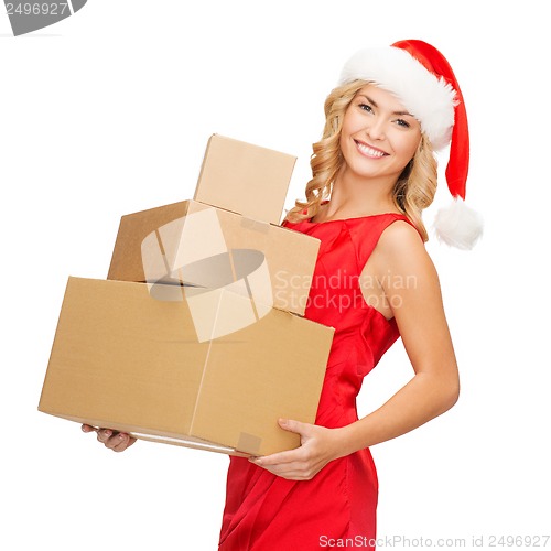 Image of smiling woman in santa helper hat with parcels