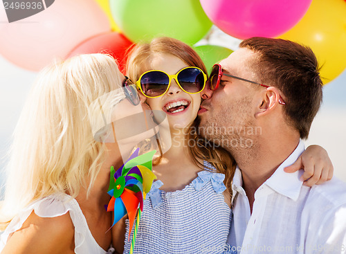 Image of family with colorful balloons