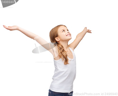 Image of smiling teenage girl with raised hands