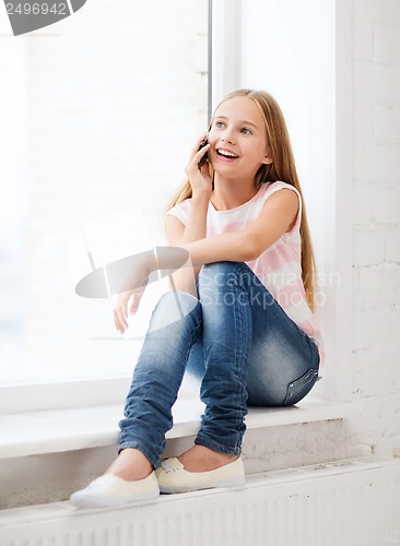 Image of girl with smartphone at school