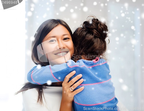 Image of hugging mother and daughter
