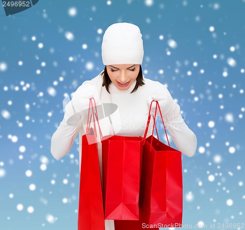 Image of picture of happy woman with shopping bags