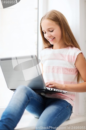 Image of girl with laptop pc at school