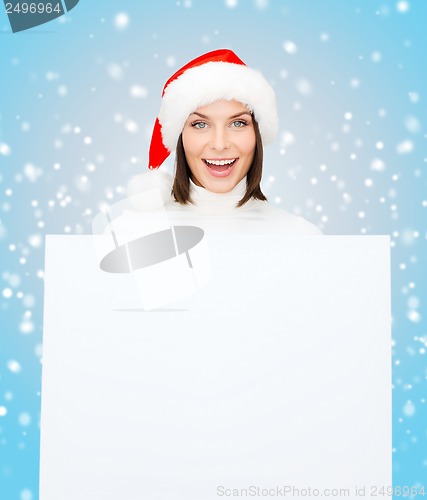Image of woman in santa helper hat with blank white board