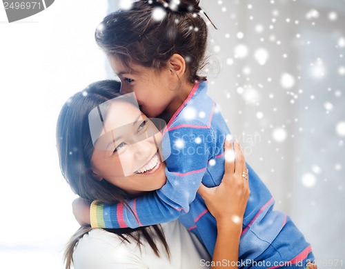 Image of hugging mother and daughter