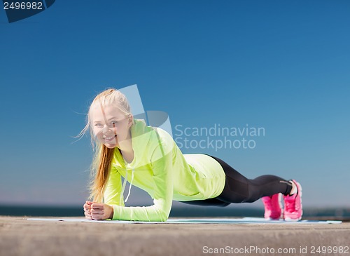 Image of woman doing sports outdoors