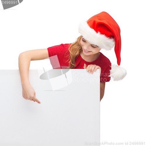 Image of woman in santa helper hat with blank white board