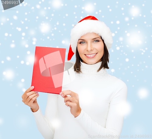 Image of woman in santa helper hat with blank red card
