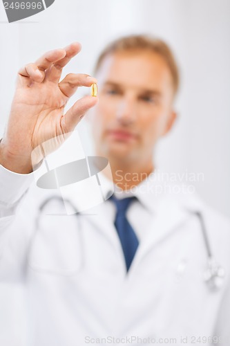 Image of doctor with pill in hospital