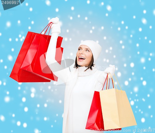 Image of picture of happy woman with shopping bags