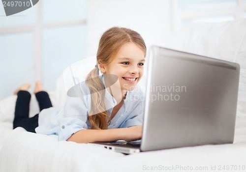 Image of girl with laptop pc at home
