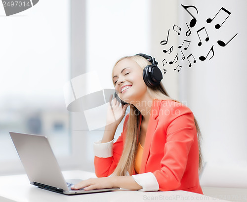 Image of happy woman with headphones listening to music