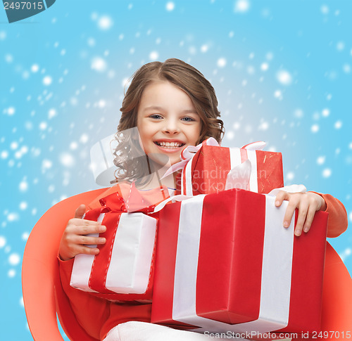 Image of happy child girl with gift boxes