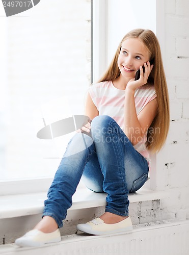 Image of girl with smartphone at school