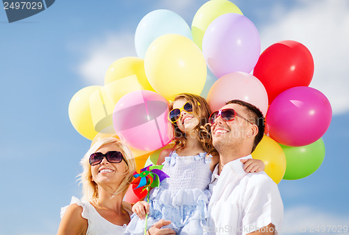 Image of family with colorful balloons