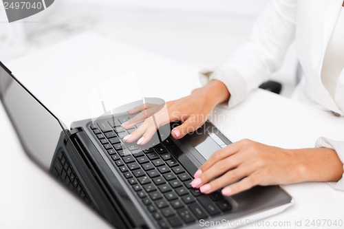 Image of businesswoman using her laptop computer