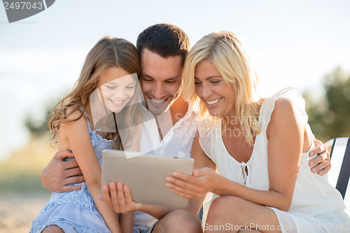 Image of happy family with tablet pc taking picture
