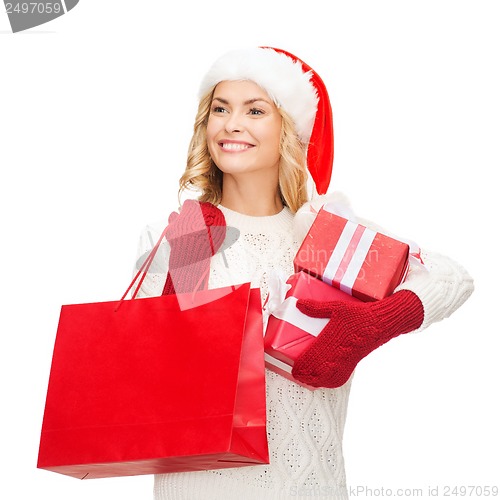 Image of woman in santa helper hat with shopping bags