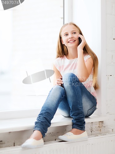 Image of girl with smartphone at school