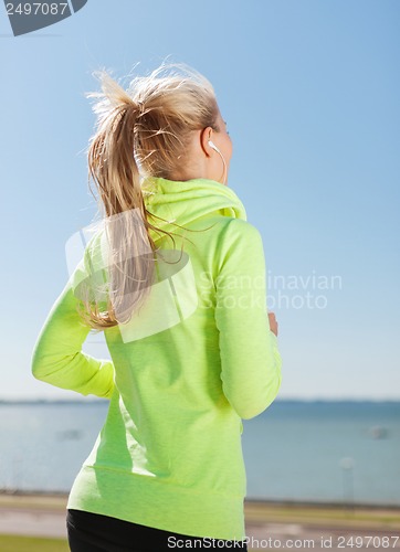 Image of woman doing running outdoors