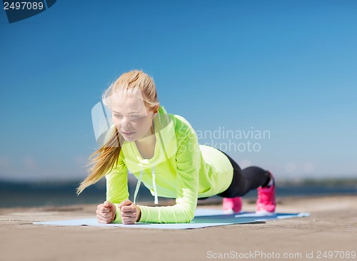 Image of woman doing sports outdoors