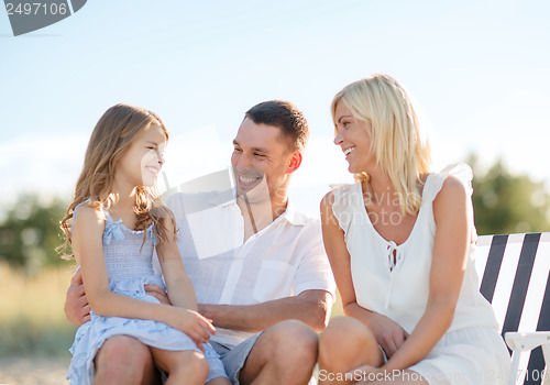 Image of happy family having a picnic
