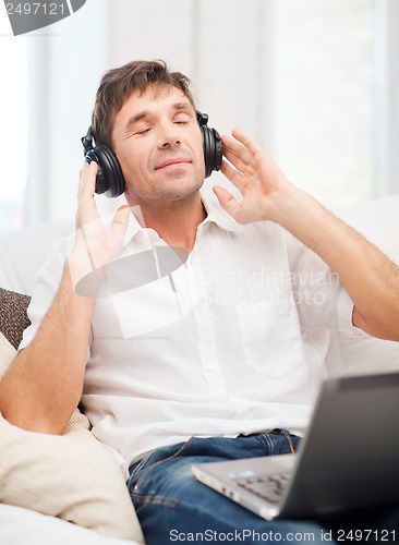 Image of man with headphones listening to music