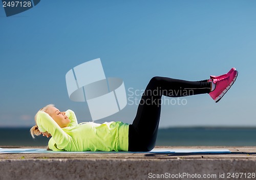 Image of woman doing sports outdoors